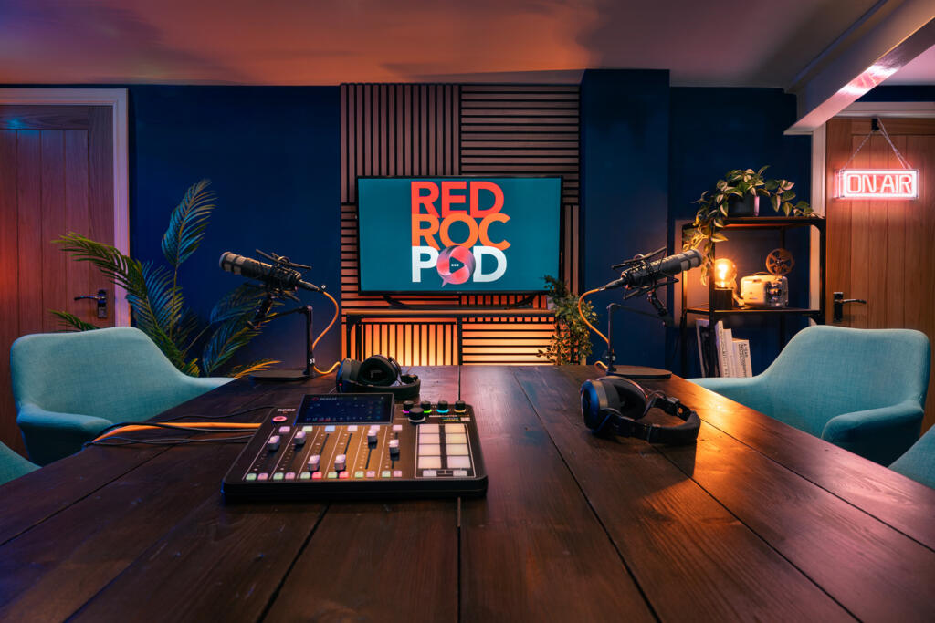 Podcast studio with microphones and recording desk